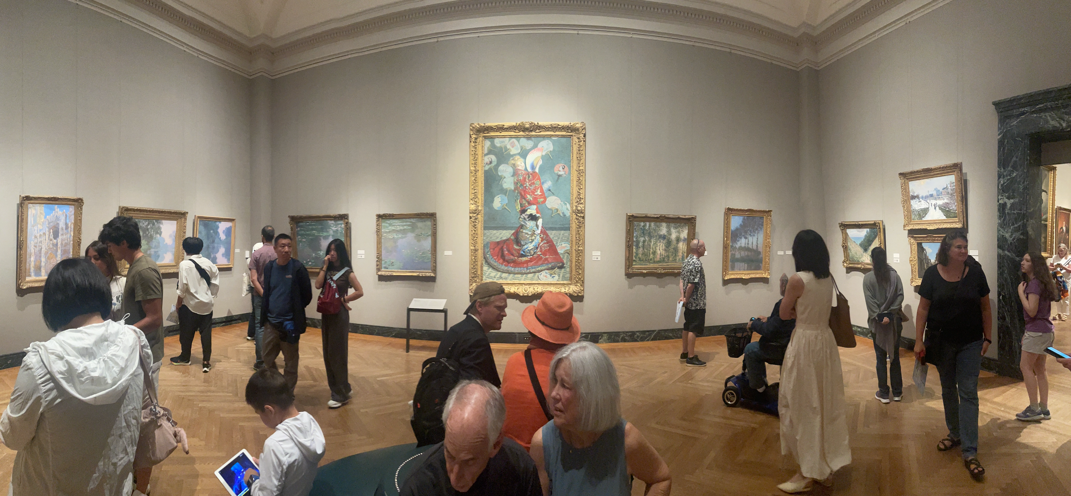 Patrons at the Museum of Fine Arts Boston viewing work by Impressionist Claude Monet.